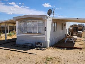a small white house with a window on it at 1 Bdrm Grand Canyon Bridge Rental in Dolan Springs