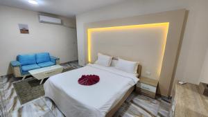 A bed or beds in a room at Alex sea view apartment - families only