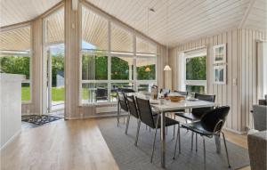 a dining room with a table and chairs at Gorgeous Home In Hals With Sauna in Hals