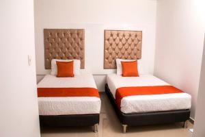 A bed or beds in a room at ALESOMAYA APARTHOTEL
