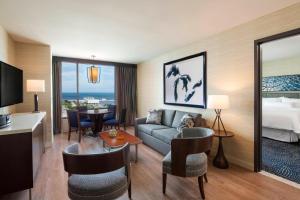 a hotel room with a couch and a bed at The Westin Milwaukee in Milwaukee