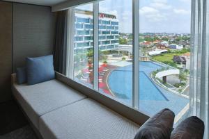 a hotel room with a view of a swimming pool at Yogyakarta Marriott Hotel in Yogyakarta