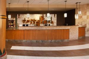 a lobby of a restaurant with a bar at Sheraton Anchorage Hotel in Anchorage