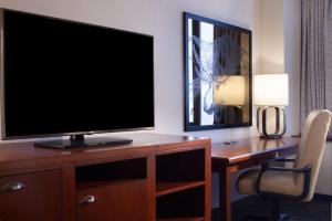 a television on a desk in a hotel room at Sheraton Anchorage Hotel in Anchorage