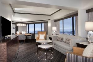 a living room with a couch and a table at Sheraton Anchorage Hotel in Anchorage