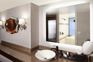 a bathroom with a sink and a mirror at Sheraton Anchorage Hotel in Anchorage