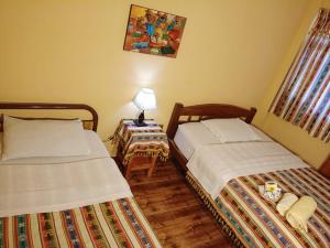 Katil atau katil-katil dalam bilik di Hostal Torotoro