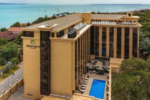 an aerial view of a hotel with the ocean in the background at Element by Westin Hotel Dar es Salaam in Dar es Salaam