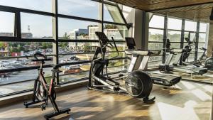 a gym with cardio machines and a view of a harbor at Holiday Inn Express Nantong Xinghu by IHG in Nantong