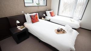 Cama o camas de una habitación en Neyuki Townhouse