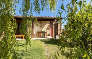 vista di una casa attraverso gli alberi di Nice Home In Volterra With Private Swimming Pool, Can Be Inside Or Outside a Montaperti