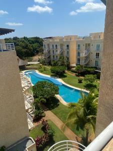 a view of the pool from the balcony of a resort at Marina Diamante in Acapulco