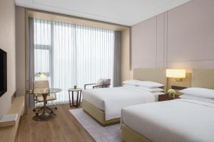 Postel nebo postele na pokoji v ubytování Courtyard By Marriott Xi'an North