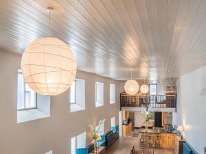 a room with several lights hanging from the ceiling at The Old Brewery in Pembroke