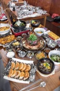 a table topped with lots of different types of food at Private Bath Ensuite Room Eastwood/MQ Uni park in Sydney