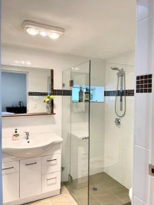 a bathroom with a sink and a shower at Private Bath Ensuite Room Eastwood/MQ Uni park in Sydney