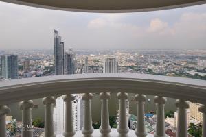 a view of the city from the balcony of a building at Tower Club at lebua in Bangkok