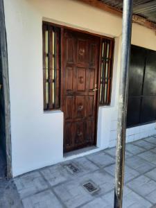 a wooden door on the side of a house at Domingo in Goya