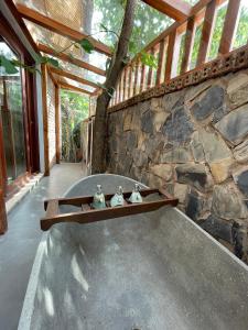 a stone wall with two figurines on a shelf at Natalie's Villa & Resort in Mộc Châu