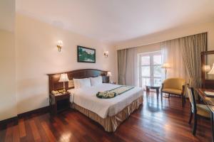 Letto o letti in una camera di Saigon Dalat Hotel