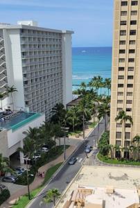 an aerial view of a street in front of two tall buildings at Waikiki Condo 2 Bedrooms 2 Bathrooms with 1 free parking space in Honolulu