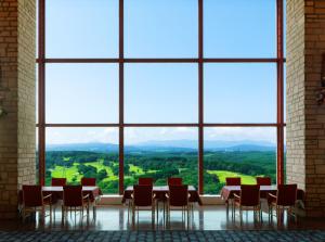 a table and chairs in a room with large windows at Kitahiroshima Classe Hotel in Kitahiroshima +179 photos