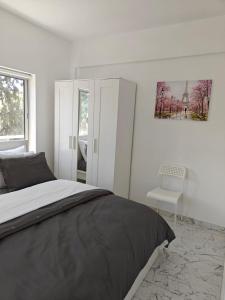 Ένα ή περισσότερα κρεβάτια σε δωμάτιο στο Amalia Residences