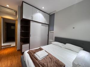 Tempat tidur dalam kamar di Mộc Homestay VIP