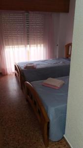 A bed or beds in a room at Florazar 2 Cullera