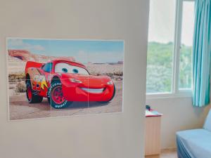 a close up of a disney cars picture on a wall at 炎島 & 莎蔓民宿Salman in Green Island