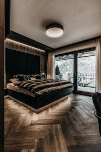 En eller flere senger på et rom på ONKL XONNA Premium Alpin Chalets