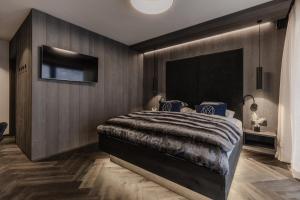 En eller flere senger på et rom på ONKL XONNA Premium Alpin Chalets