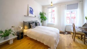Postel nebo postele na pokoji v ubytování Casa Wimpina - geschmackvolles Appartement im Herzen der Altstadt