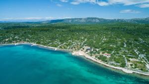 an aerial view of a beach next to the water at Villa Maris in Betina