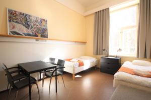 Postel nebo postele na pokoji v ubytování Forenom Hostel Röykkä