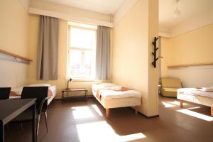 Postel nebo postele na pokoji v ubytování Forenom Hostel Röykkä
