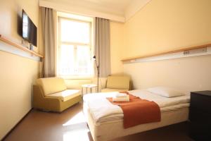 Postel nebo postele na pokoji v ubytování Forenom Hostel Röykkä