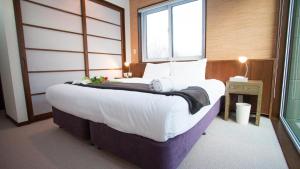 Cama o camas de una habitación en Toshokan Townhouse