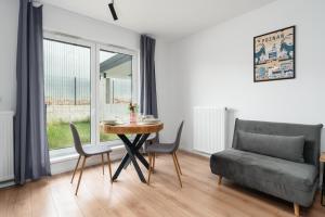 Posezení v ubytování Apartments with Garden Dmowskiego 81 by Noclegi Renters + 33 fotografií