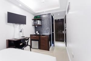 Postel nebo postele na pokoji v ubytování Nest Nano Suites Poblacion - Makati