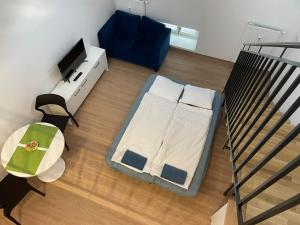 Postel nebo postele na pokoji v ubytování Mezonet - Postovska Centr Apartments
