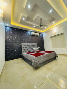 a bedroom with a bed in a room at Second home International airport T-1 in Trivandrum
