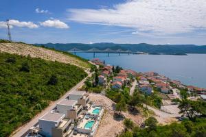 an aerial view of a town next to a body of water at Villa Hedonist in Komarna