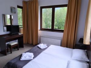 Postel nebo postele na pokoji v ubytování M&R Apartment C13 - SPA Terra Complex