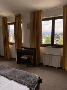Postel nebo postele na pokoji v ubytování M&R Apartment C13 - SPA Terra Complex