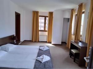 Postel nebo postele na pokoji v ubytování M&R Apartment C13 - SPA Terra Complex