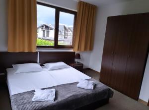 Postel nebo postele na pokoji v ubytování M&R Apartment C13 - SPA Terra Complex