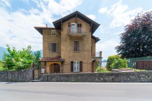 a building on the side of a road at Bright and Cozy in Menaggio by Wonderful Italy in Menaggio