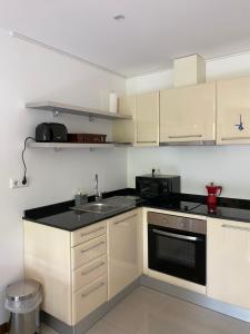 Kuchyň nebo kuchyňský kout v ubytování M&R Apartment C13 - SPA Terra Complex