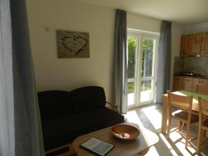 a living room with a couch and a table at Villa Campo in Ezerets +22 photos